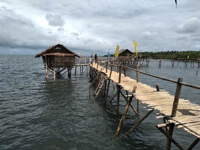 Community members transformed the coastal area into an eco-tourism site where visitors can observe the mangroves as they walk along the boardwalk and stay in a few cottages that were built. (Photo / Retrieved from Manila Bulletin)